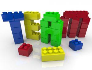 Lego pieces spell the word "TEAM"