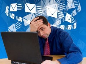 man overwhelmed by email