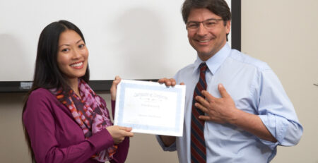 training student receiving a certificate in a DocU-Sleeve - Trainers Warehouse