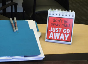 Desk sign: Don't go away mad, just go away