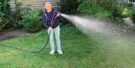Sue Watering lawn