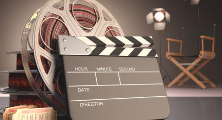 Move props, including film reel and clapboard