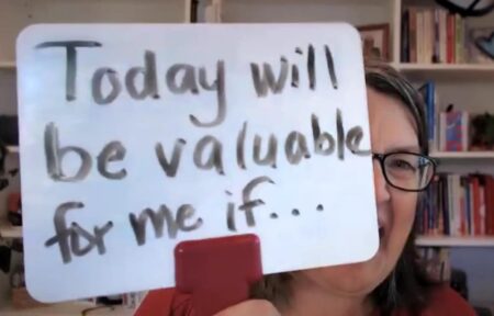 Katrina Kennedy holding personal Whiteboard that says, "Today will be valuable to me if..."